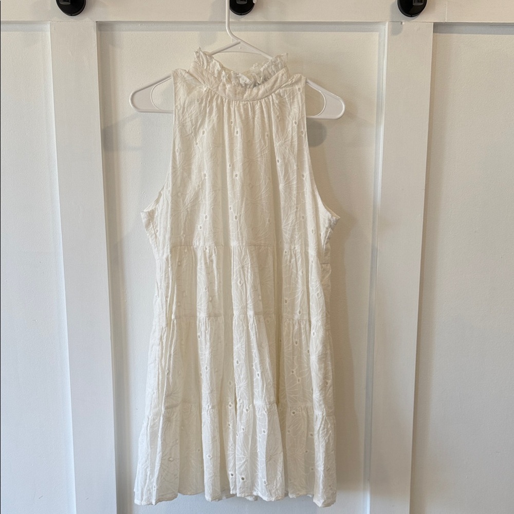 AMELIA’s White Sleeveless Eyelet Dress with ruffle neck detail